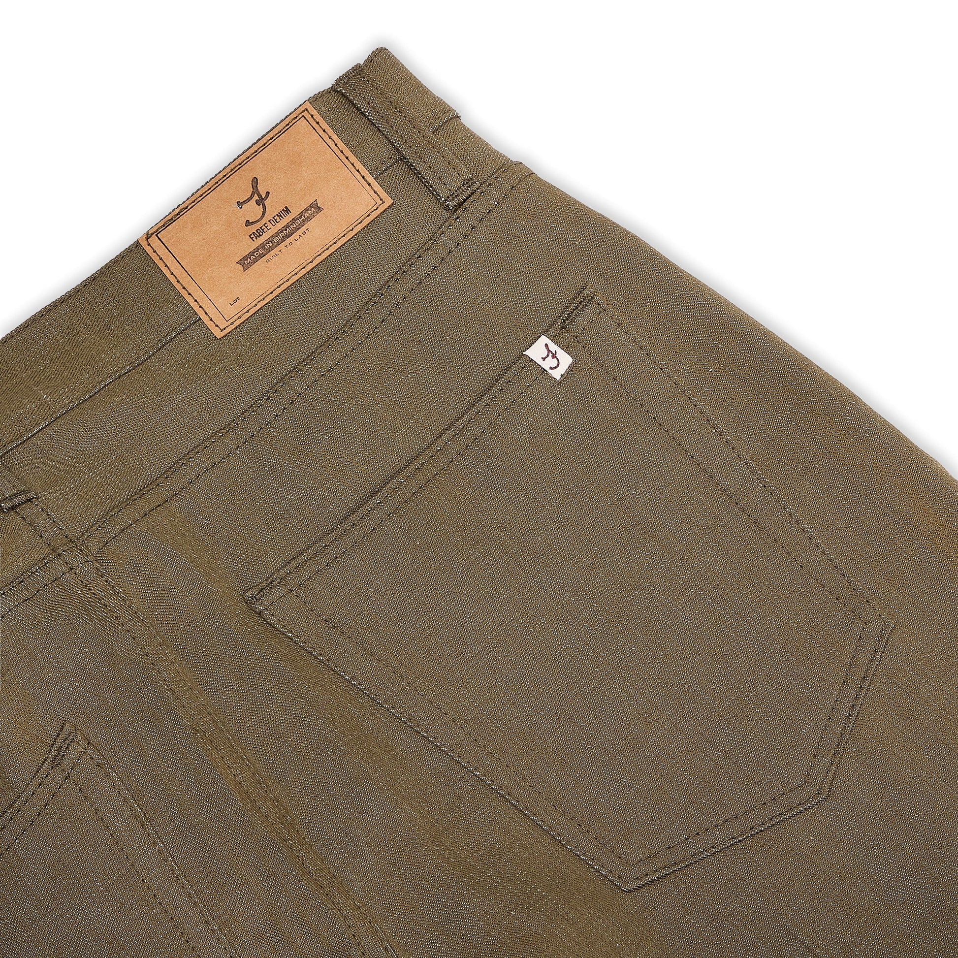 Green selvedge denim jeans, back pocket close up